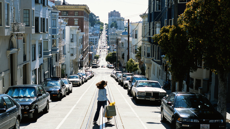 A women confidently walking forward through the streets of San Francisco