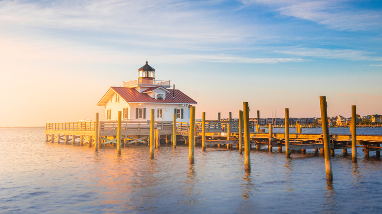 A lighthouse on a dock in the ocean Manteo, North Carolina