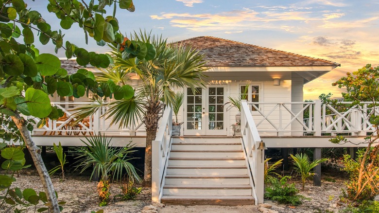 An exterior view of the Rock House villa at sunset, at Kamalame Cay on Andros Island in the Bahamas