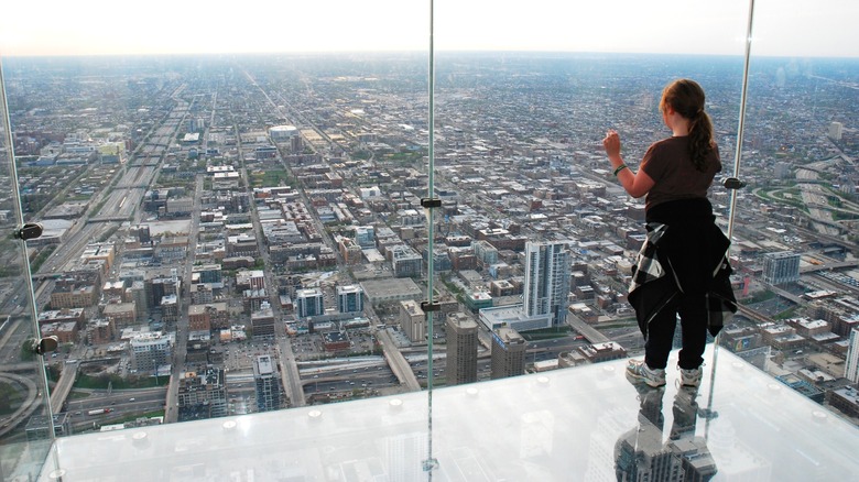 Girl looks out from the Ledge Willis Tower Chicago