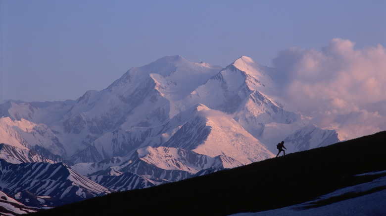 Hiker attempting mountain summit in Denali National Park and Preserve, Alaska