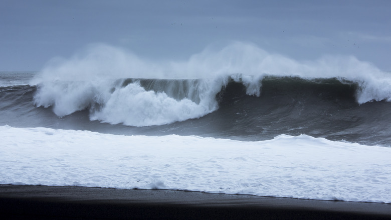 Huge waves crashing against the shore at Reynisfjara Black Sand Beach