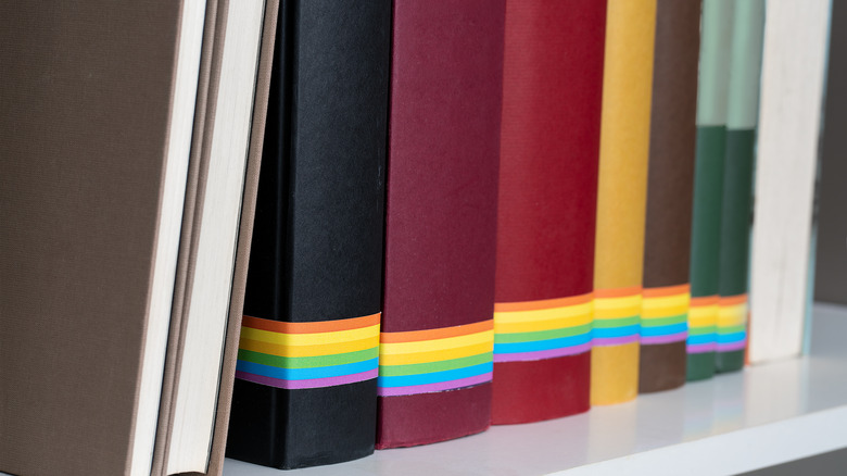 Books with the pride flag on them in a bookstore