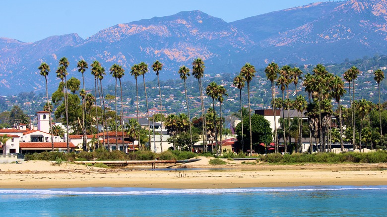 Spanish Colonial-style buildings on the beach with palm trees in Santa Barbara, California