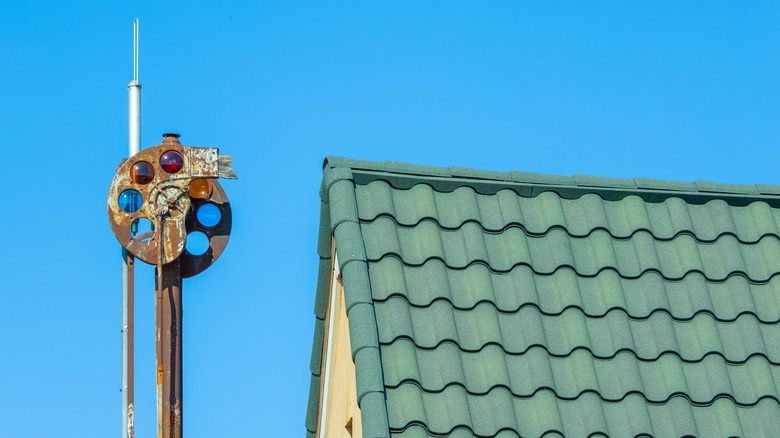 An old train light and a green roof in Dublin, Texas