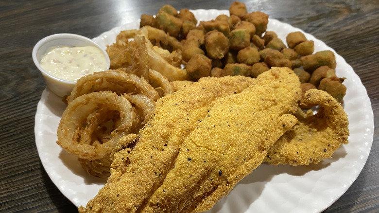 Fried catfish plate with okra, onion rings, and tartar sauce