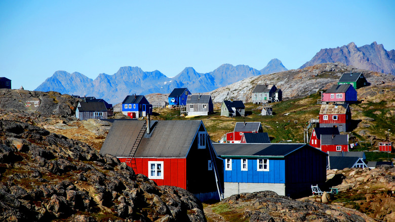 Colorful village houses nestled in the hills of Kulusuk