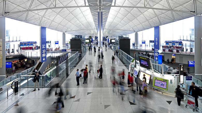 Travelers roaming HKG airport