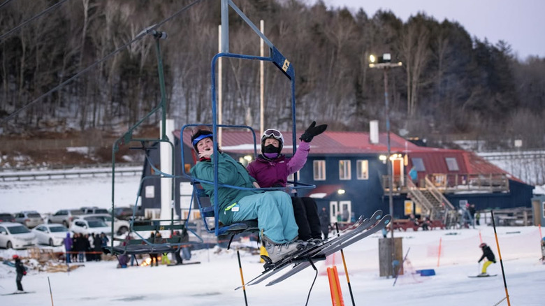 Skiers head up the lift at Whaleback Mountain