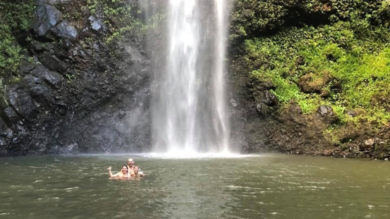 A family at Uluwehi Falls