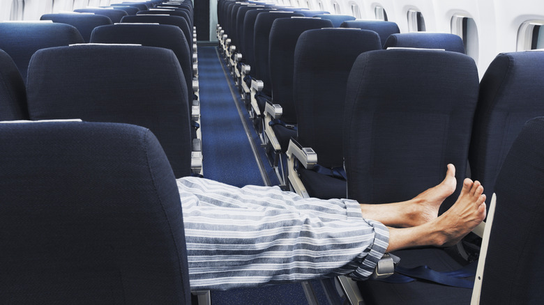 Person wearing pajamas on plane