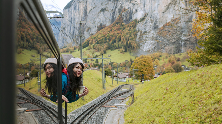 A woman riding a train