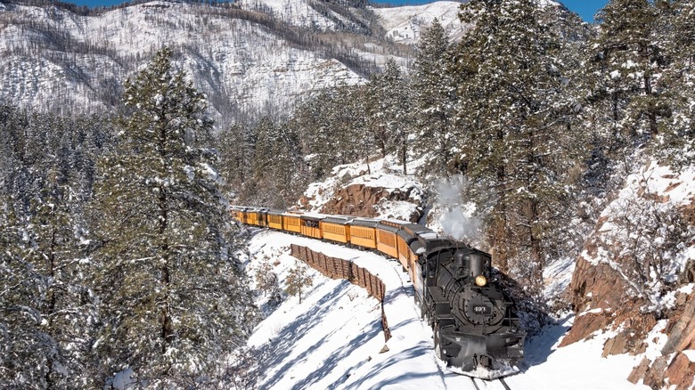 A train in snowy mountains