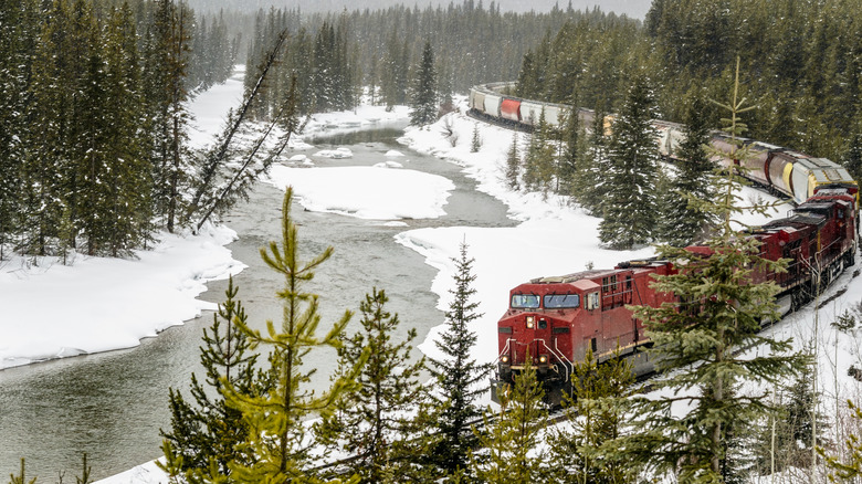 Red train driving in snow