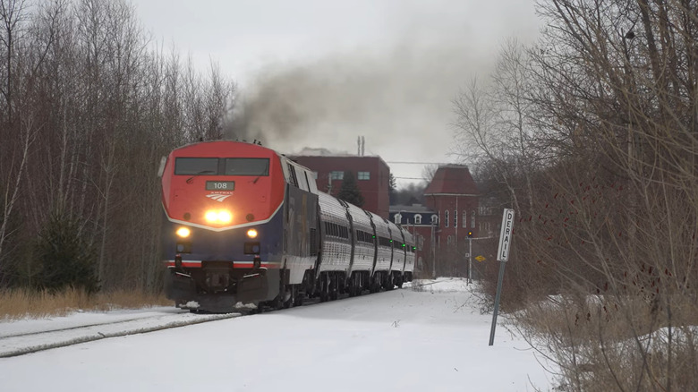 A train speeding in snow