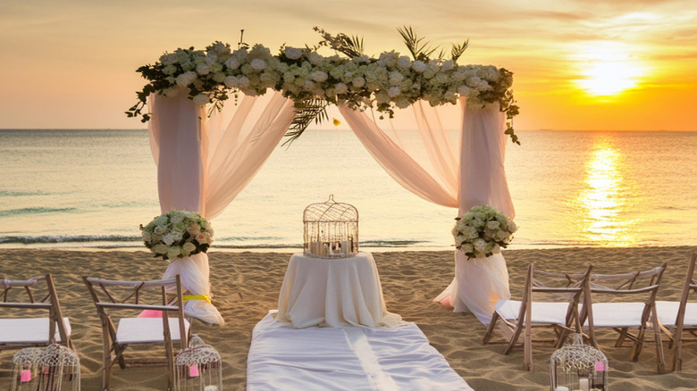 wedding arch on the beach at sunset