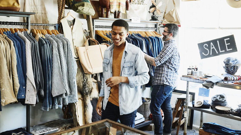 A man shopping in a men's clothing store