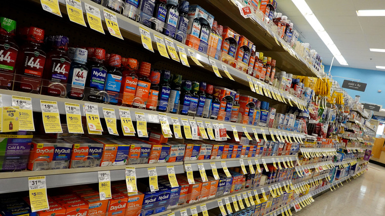 Drugstore shelves lined with medications