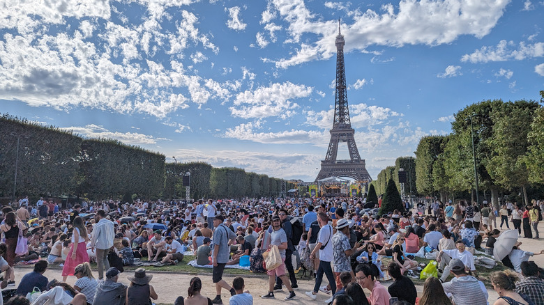 Tourists outside the Eiffel Tower