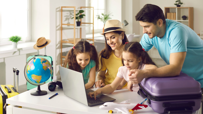 Family looking at computer