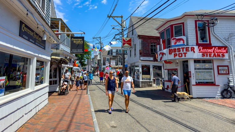 Two men walk down a street in Provincetown, Massachusetts