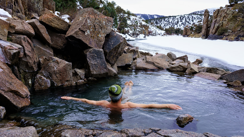 man in natural hot spring 