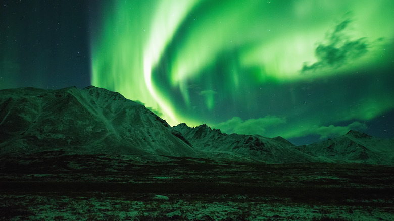 Northern Lights over snowy mountains