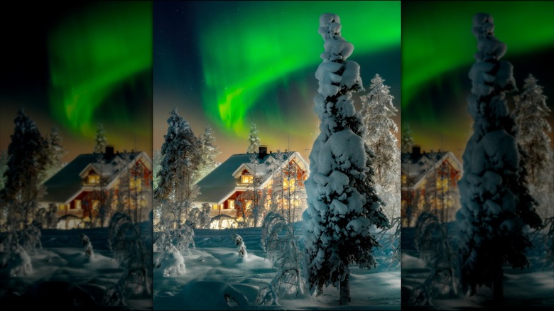 Northern Lights and snowy house