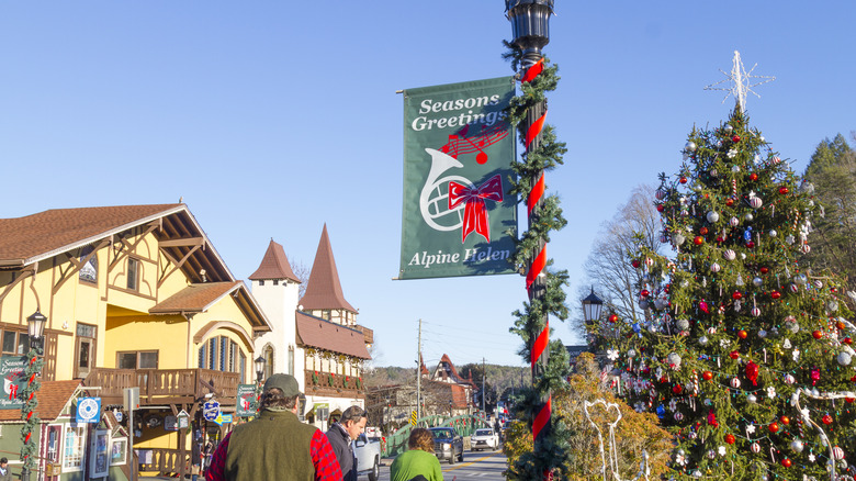 People walking by Christmas tree in Helen