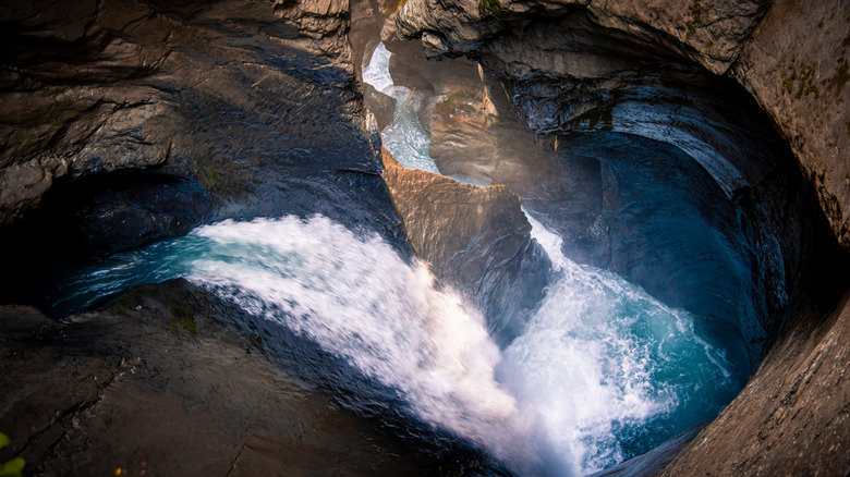 Trummelbach Falls flowing underground into cave system