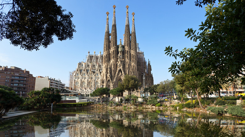 Barcelona's Sagrada Familia Cathedral with park in foreground