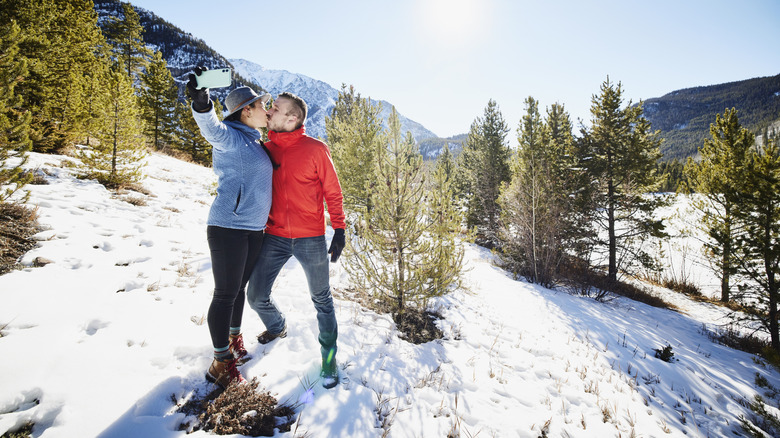 Couple kissing in snow