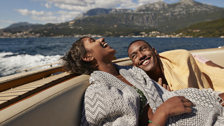 Couple laughing in boat