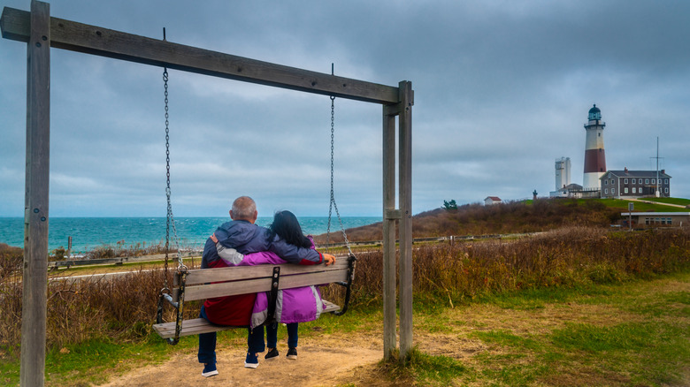 Couple sit in swing