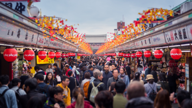 Crowded street with traditional decorations in Japan