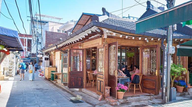 People in a wooden corner shop in South Korea