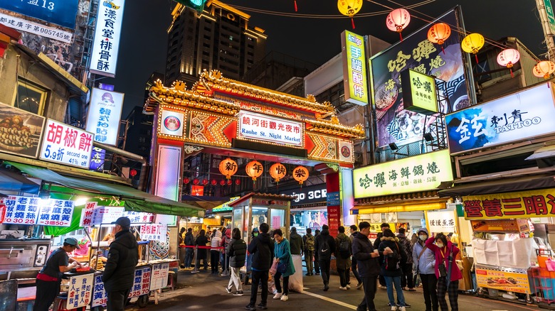 Crowded streets of Taiwan lit up at night