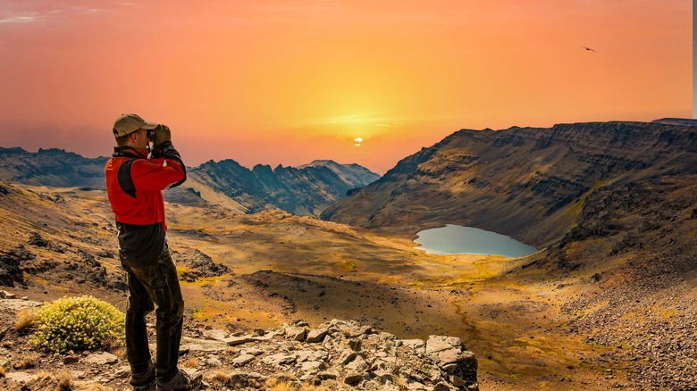 man with binoculars on Steens Mountains