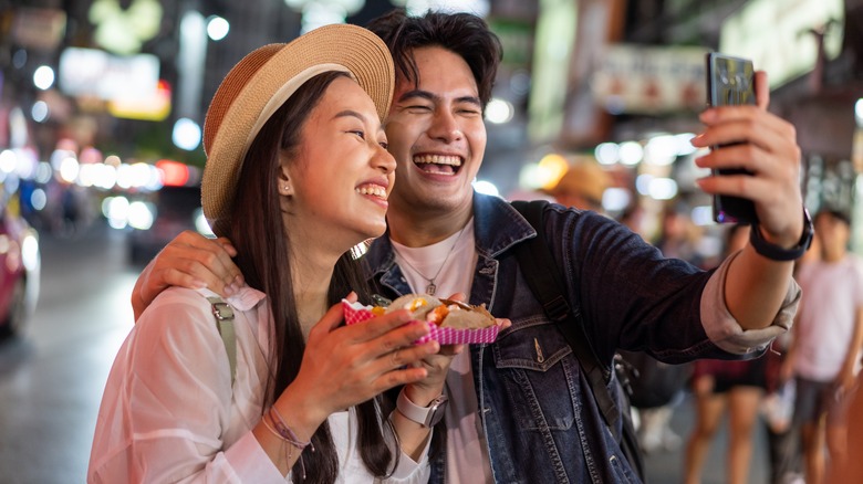 people taking selfie with food