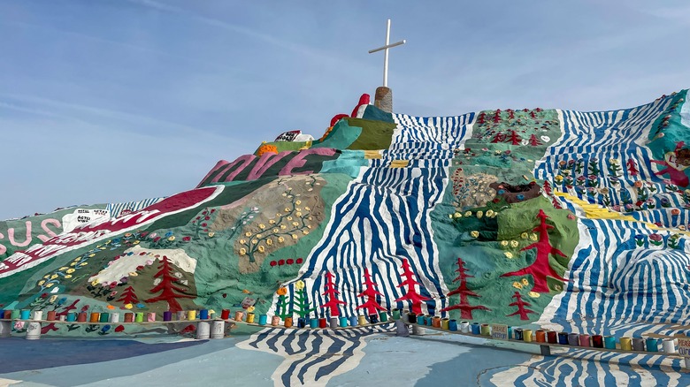 Salvation Mountain with cross on top