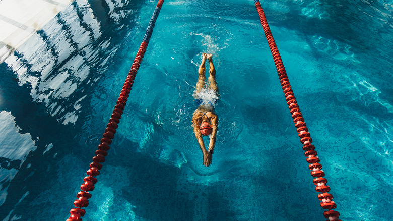 Person swimming in a pool