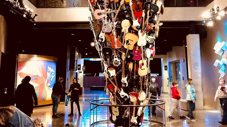 A tower of guitars on display in the Museum of Pop Culture