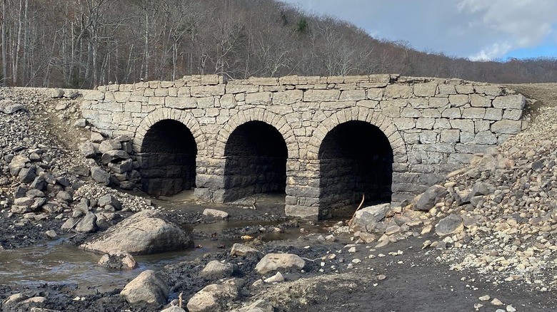 Triple arch stone ghost bridge in Oak Ridge Reservoir, New Jersey