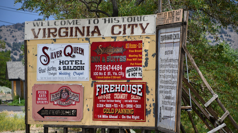 Virginia City historic sign with trees in background