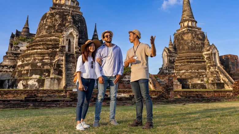 Tour guide with guests in Bangkok