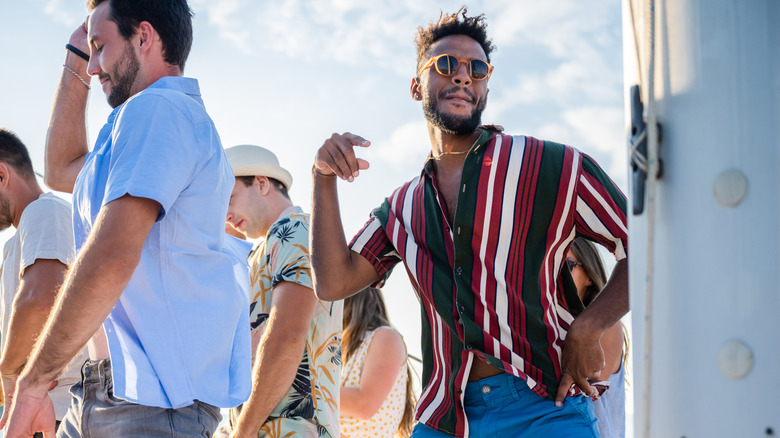 People partying on a boat in cruise attire