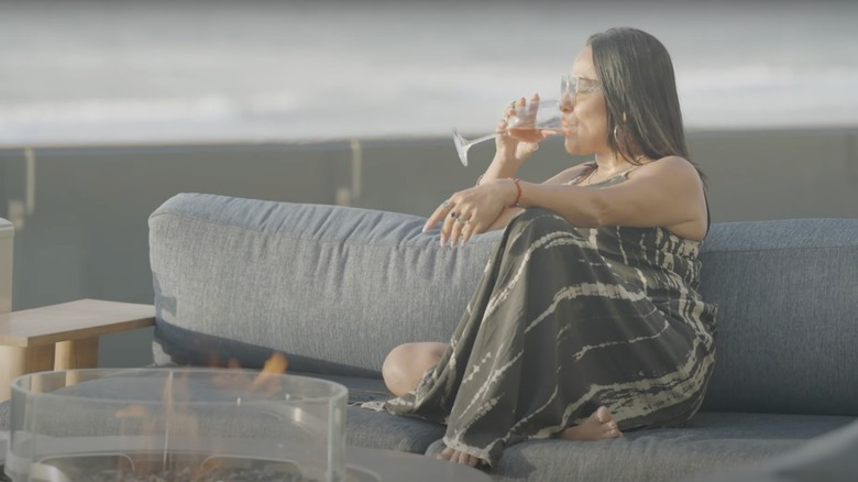 Woman drinking wine on the patio at Monterey Beach Hotel