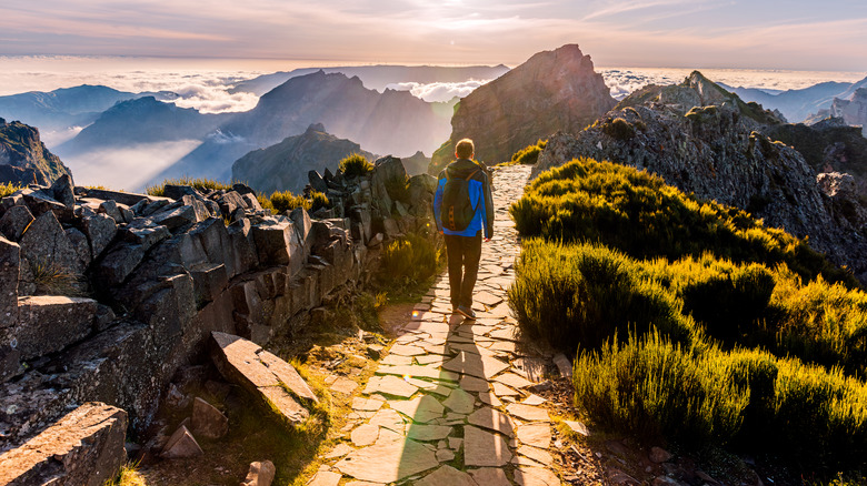 A person hiking on a trail in Madeira in Portugal