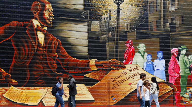 A large mural in Philadelphia near a sidewalk