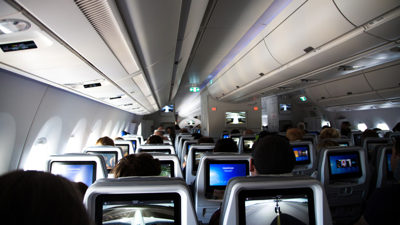 Illuminated screens in airplane cabin